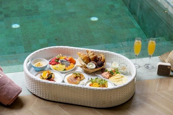 Breakfast in bed with a mimosa or a floating